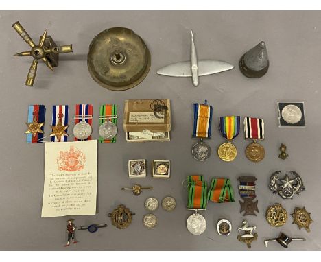 A POSSIBLE FAMILY GROUP OF FIRST AND SECOND WORLD WAR MEDALS. A Great war trio comprising War and Victory medals named to 2. 