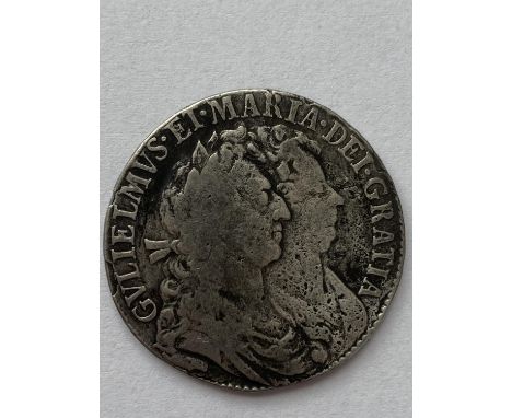 A WILLIAM AND MARY HALFCROWN. A William and mary Halfcrown dated 1689, conjoined bust r, reverse with first crowned shield.