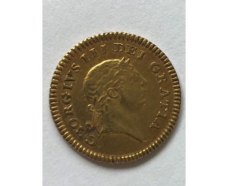 A GEORGE III THIRD GUINEA PIECE. A George III Third Guinea, second laureate head r, dated 1804. c2.9g.