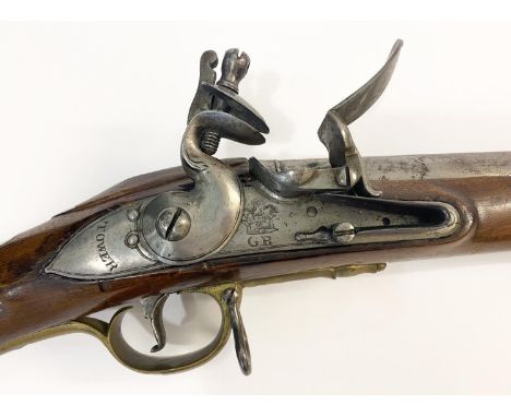 A SHORT LAND PATTERN 'BROWN BESS'. With a 106cm (42inch) barrel with ram rod below, with flintlock action,the sideplate engra