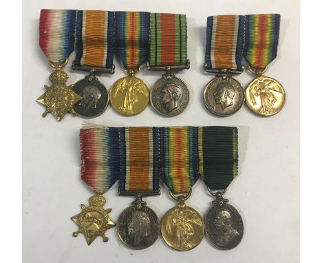 THREE GROUPS OF FIRST WORLD WAR MINIATURES. A group of four miniatures comprising Great War trio and Defence Medal, mounted a