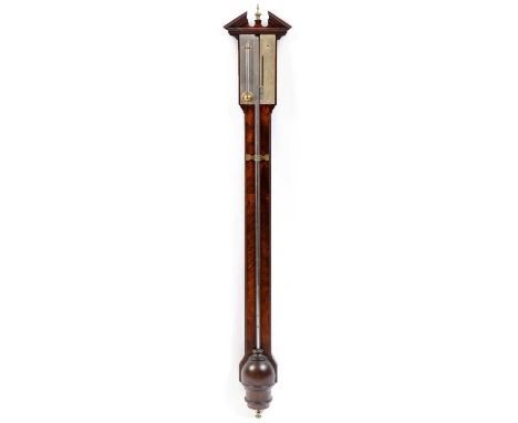 A 19th Century mahogany stick barometer, with broken swan neck pediment above a silvered and brass vernier, with mercury tube