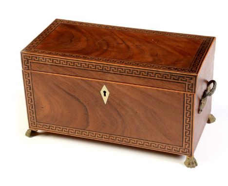 A 19th Century flame mahogany tea caddy, of rectangular section with Greek key borders and stainwood stringing, having a pair