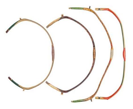 FOUR CHINESE COMPOSITE BOWS, QING DYNASTY, 19TH/20TH CENTURY the first with reflexed limbs faced with horn on the belly paint