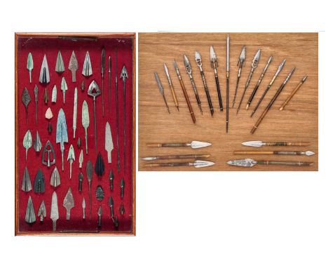 TWO DISPLAYS OF ARROWHEADS, FOUR COPPER ALLOY ARROWHEADS AND A QUIVER, POSSIBLY TIBETAN the first with nineteen arrowheads, o