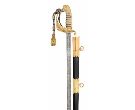 A POST 1902 NAVAL OFFICER’S SWORD of regulation type, with etched blade decorated over three-quarters of its length with foli
