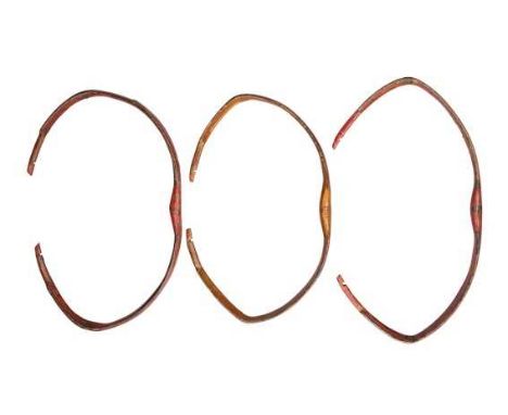 THREE INDO-PERSIAN BOWS, 19TH CENTURY 
the first with extremely reflexed red limbs, with inscriptions on the ears (siyah) and