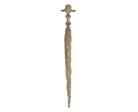 A RARE LURISTAN IRON AGE II DAGGER, 1100-900 B.C. ‡ in excavated condition, with tapering blade formed with a broad medial ri