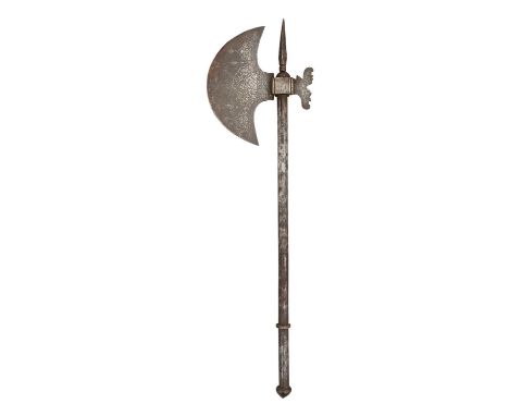 AN INDO-PERSIAN AXE, 19TH CENTURY formed entirely of steel, with crescentic head, cusped rear pean, robust terminal spike, an