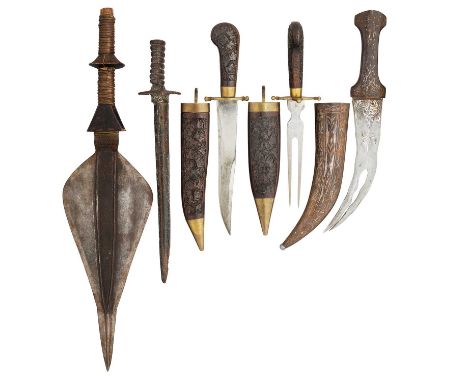 A LARGE AFRICAN SPEARHEAD, A DAGGER (JAMBIYA), A COPPER ALLOY ANCIENT STYLE DAGGER, AND A KNIFE AND FORK SET, 20TH CENTURY
th