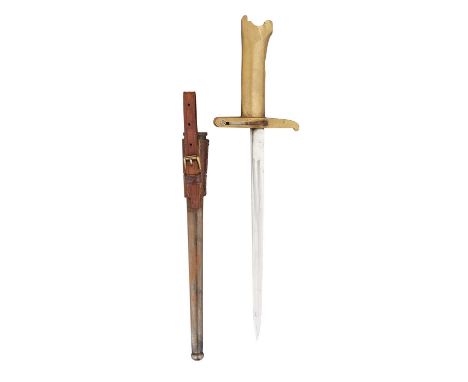 A PRITCHARD-GREENER REVOLVER BAYONET, CIRCA 1917 with a narrow triangular blade and hollow gunmetal cast hilt stamped "WWG" o