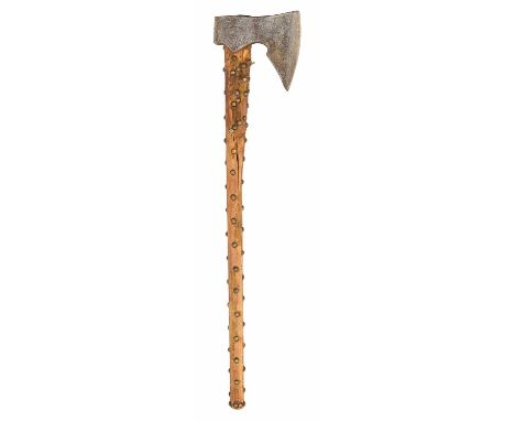 A BEARDED AXE, 18TH/19TH CENTURY with border-engraved head formed with a pronounced 'beard' flat rear pean, and wooden haft s