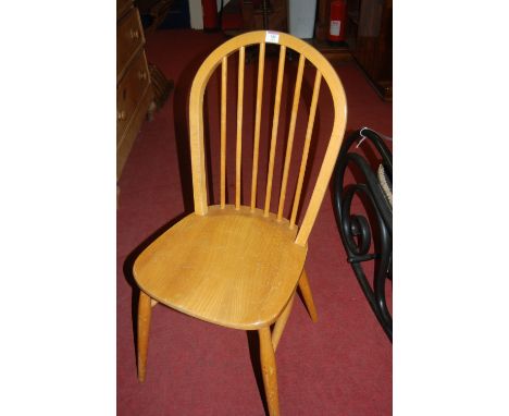 A set of four Ercol style light elm stickback kitchen chairs 