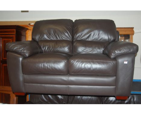 A modern chocolate brown leather upholstered two piece suite comprising; three seater sofa and two seater sofa