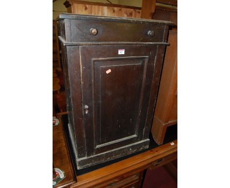 A late Victorian stained pine hinge top washstand having interior mirror and ceramic bowl with single cupboard door labelled 