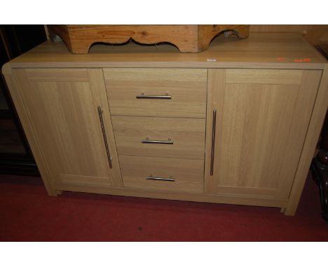 A modern light oak effect sideboard 