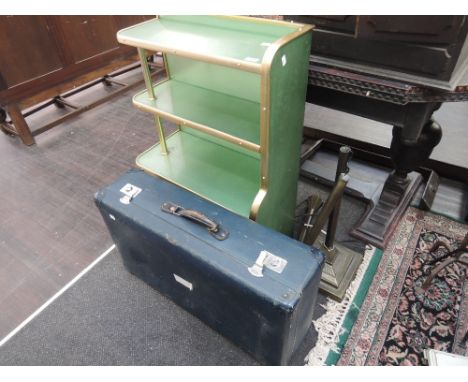 A vintage metal shelf, modern lamp and suitcase