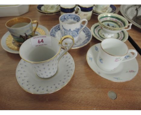 Five cabinet cups and saucers including a beehive marked to commemorate the Imperial Exhibition London 1909