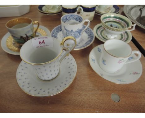 Five cabinet cups and saucers including a beehive marked to commemorate the Imperial Exhibition London 1909