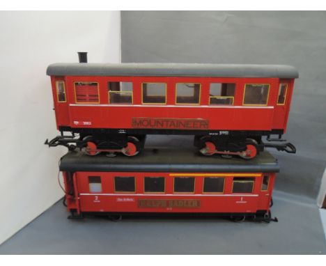 An LGB G scale eight wheeled passenger car 3063 and carriage