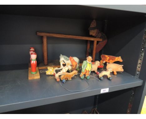 A selection of vintage wooden toys including Chad Valley pull along farmer and farm animals etc