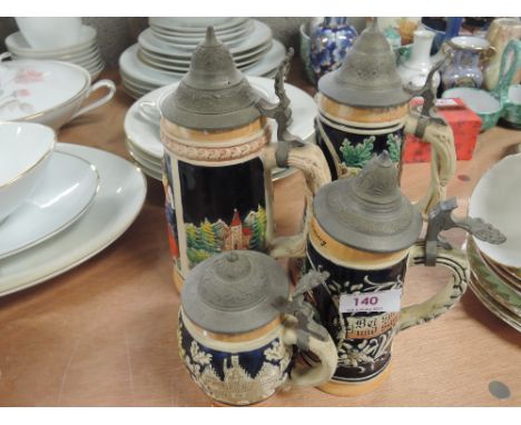 Four ceramic beer steins 