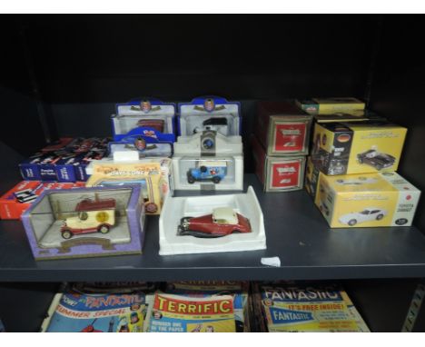 A shelf of modern mixed die-casts including Corgi, Atlas, Lledo etc, all boxed