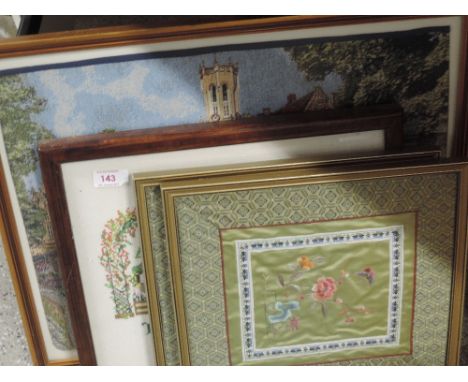 A framed tapestry, cross stitch and two silk panels