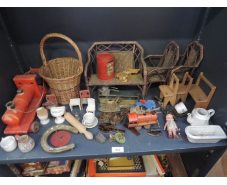 A shelf of vintage toys including miniature furniture, ceramics and brass ware, a wooden pull along train etc