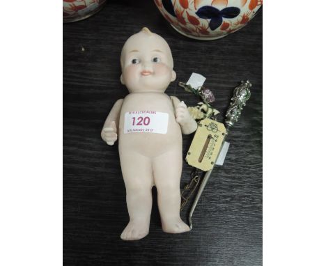 A Kewpie bisque doll having moveable arms, a miniature Salter spring balance and a plated buttonhook etc