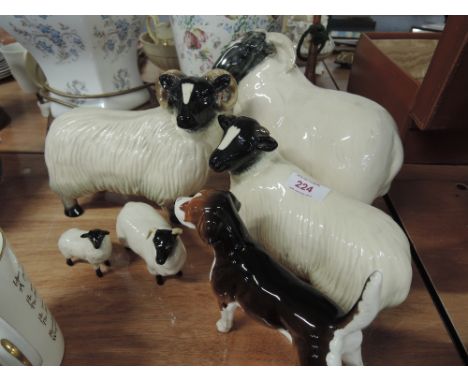 A Beswick Scotch Blackface ewe and lamb A/F, three large Beswick style sheep including one as a money box and a similar Fox h