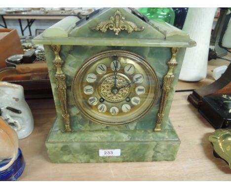 A green marble mantle clock