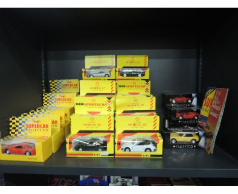 A shelf of modern mixed Maisto and Shell die-casts, sports car collection