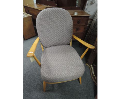 An Ercol light beech upholstered armchair