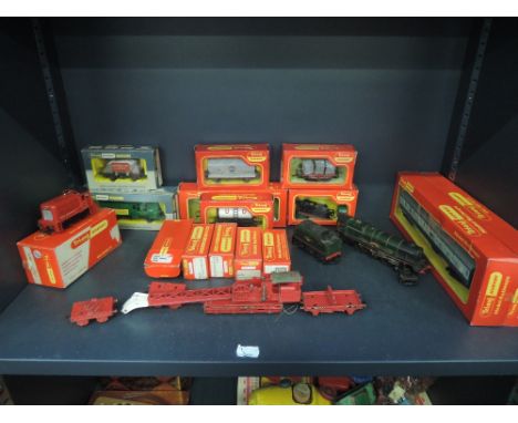 A shelf of Triang Hornby and Triang Wrenn 00 gauge inc 4-6-2 loco and tender, Princess Elizabeth, Brakedown crane, 0-6-0 dock
