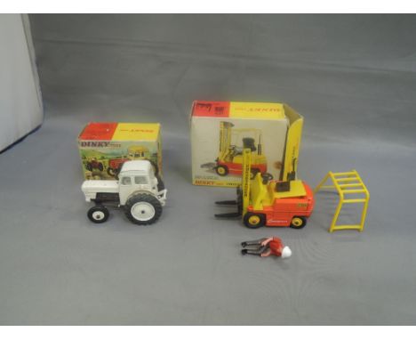 Two Dinky diecasts, David Brown tractor in original box 305 and Conveyancer fork lift truck in original box 404