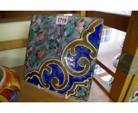 An antique Italian pottery tile, indistinctly stamped verso, bearing label inscribed 'Entrance House, Cassino, 1943'.