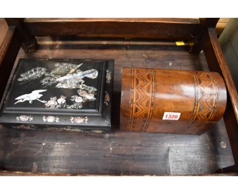 A Victorian parquetry dome top tea caddy; together with an oriental lacquer casket. 