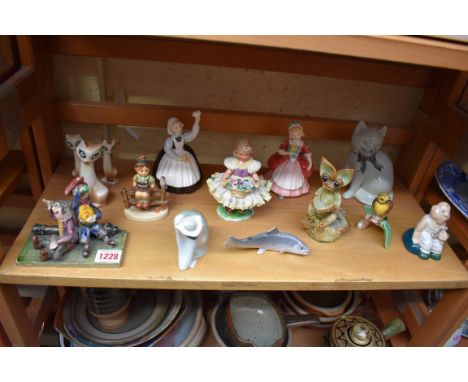 A mixed of group of ceramics, to include: two Royal Doulton figures; a Rye pottery cat; a Royal Copenhagen trout; and Goebel 