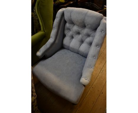 A late Victorian walnut and button upholstered low occasional chair. 