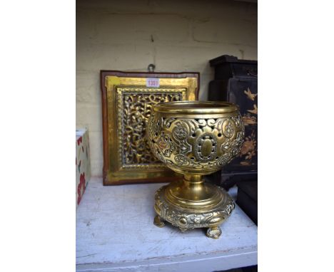 A brass lamp base; together with another mahogany mounted pierced brass plaque. 