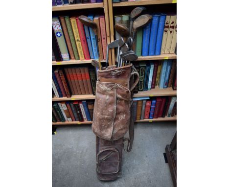 A vintage bag of old golf clubs.