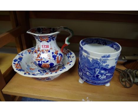 A 19th century Imari stoneware small jug and basin; together with another 19th century blue and white jardiniere; and a pair 