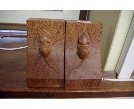 A pair of Robert Mouseman Thompson oak bookends, 14.5cm high. 
