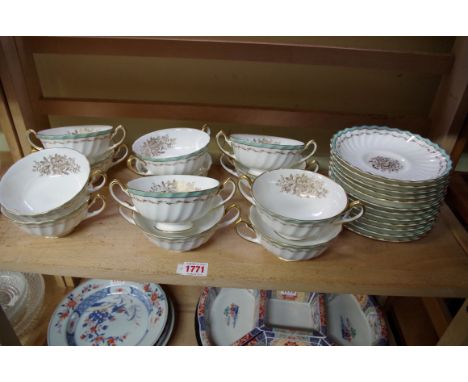 A set of twelve Royal Doulton porcelain 'Camrose' pattern breakfast cups and saucers, (chips). 