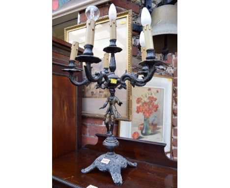 A painted metal figural six light candelabrum.  Condition Report: Not old, was always electric.