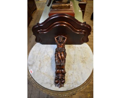 A carved mahogany figural wall bracket, 51cm wide. 