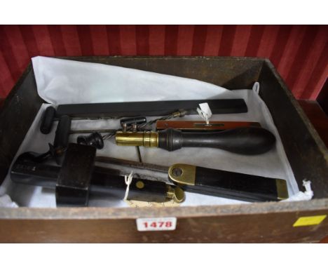 A small quantity of ebony woodworking tools, to include a small level, stamped 'Hockley Abbey'. 