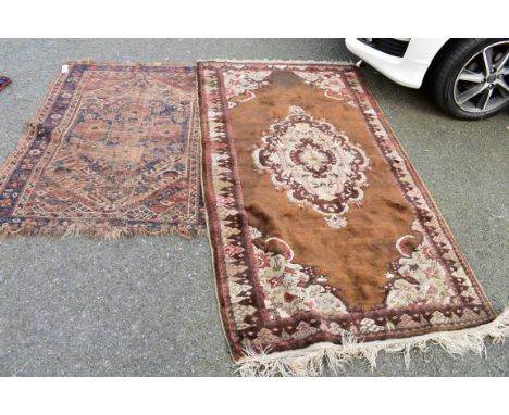 An Afghan rug having floral and geometric border; together with another rug having central floral medallion, largest 191 x 10