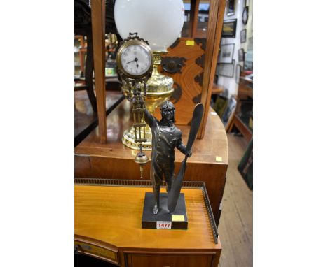 A bronzed figural mystery clock, modelled as an airman with a propeller, 38cm high. 